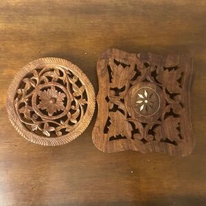 Vintage wooden hand carved trivets from India.